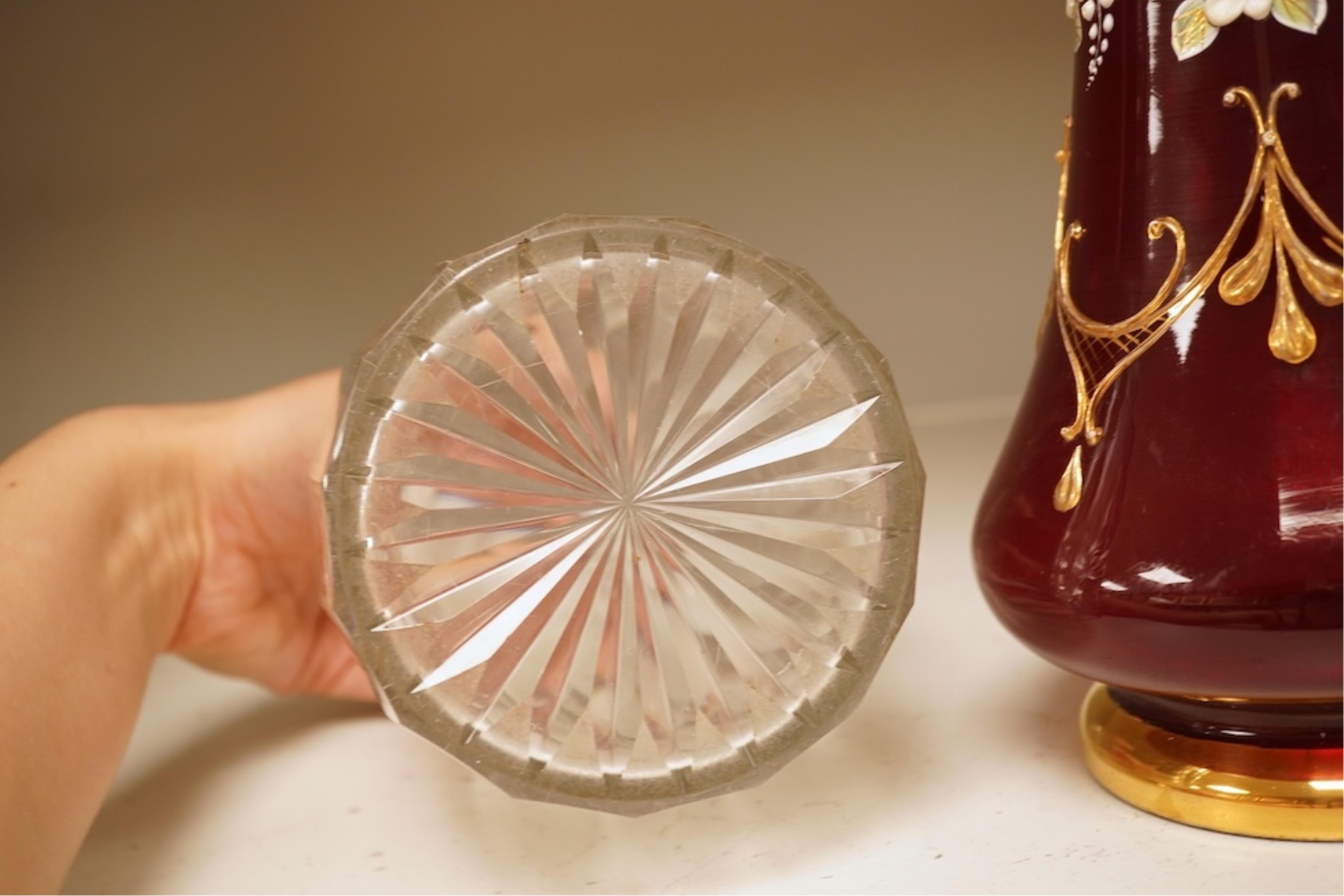 A pair of Victorian glass decanters, later stoppers, and an enamelled ruby glass vase, latter 32cm high